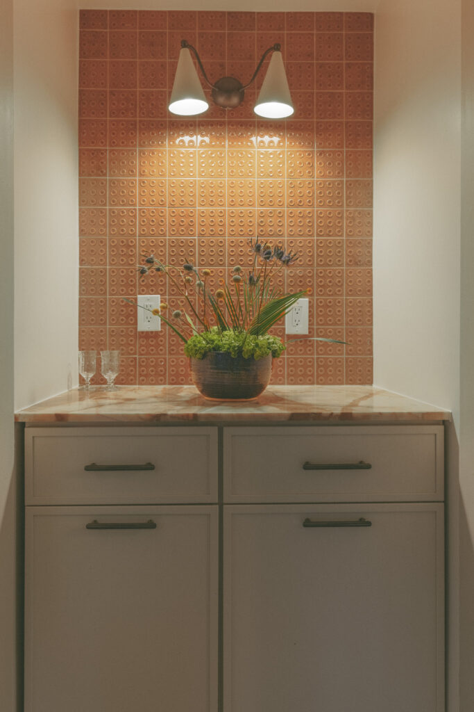 Coffee bar nook with dimensional ochre tile backsplash and brass sconce lighting by Tenlie Mourning
